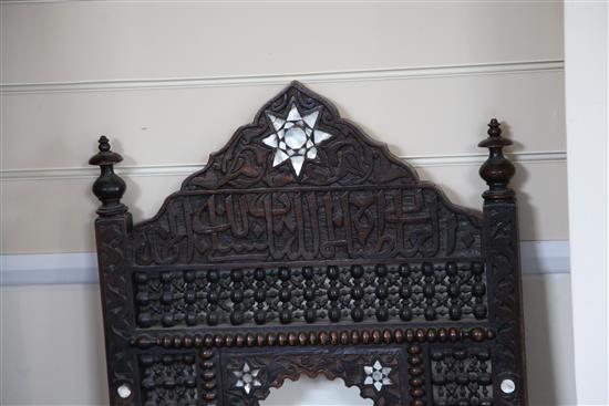 A late 19th century moorish open armchair and a similar armchair